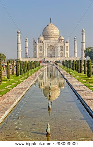 Agra, India - March 5 2018: Tourists Sighteseeing, Exploring And Admiring Famous The Taj Mahal