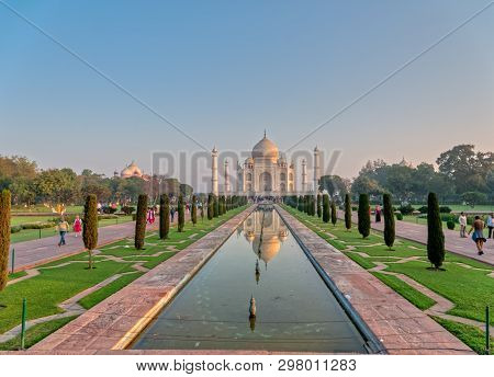 Agra, India - March 5 2018: Tourists Sighteseeing, Exploring And Admiring Famous The Taj Mahal