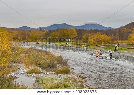 Malkinskiye Hot Springs, Malka, Russia- 27 September 2014: People In A Hot Springs In The Center Kam