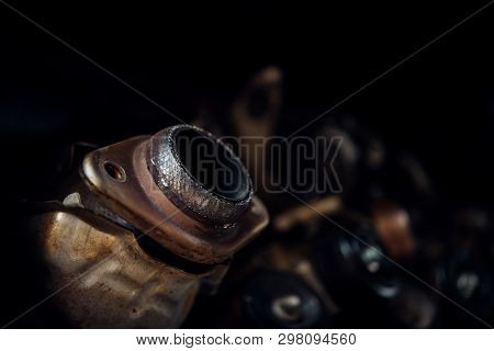 Disassembled Car Engine And Muffler At Garage