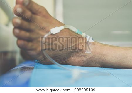 Patient With Saline Intravenous In The Hospital