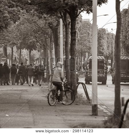 Strasbourg, France - Apr 28, 2019: Rear View Of Pedestrians Looking At Police Gendarmerie Securing A
