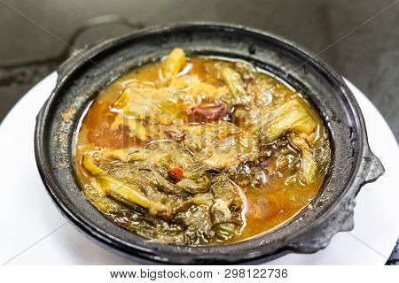Traditional Chinese Sour Spicy Mustard Vegetable Delicacy In Claypot