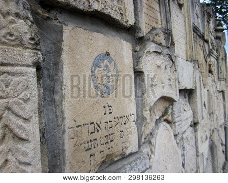 Chernivtsi, Ukraine - 12 May 2009 Abandoned Jewish Cemetery With Stone Graves Between Trees. Photo C