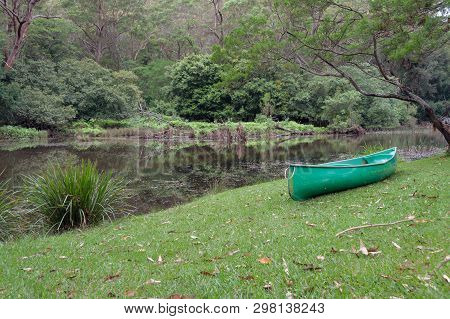 Green Kayak, Canoe Boat Near The River In The Forest. Royal National Park, Australia