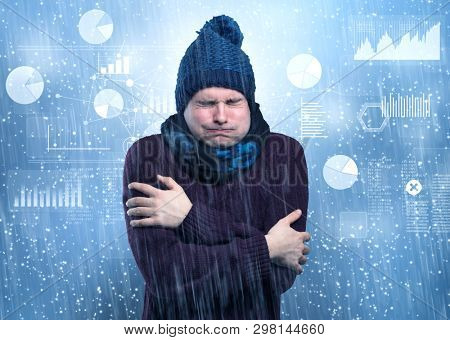 Young businessman shivering with graphs, reports and chart concept