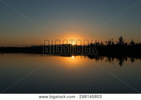 Calm And Quite Nature Landscape On Sunset With Still Water And Trees. Tranquil Nature Background