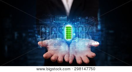 Elegant hand holding battery with full of energy