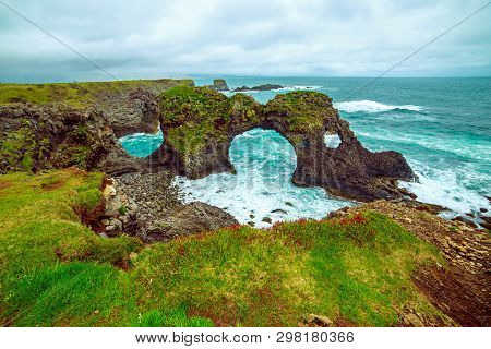 Amazing Seascape, Gatklettur Basalt Rock Arch At The Volcanic Cliff, Atlantic Coast Of Arnarstapi In
