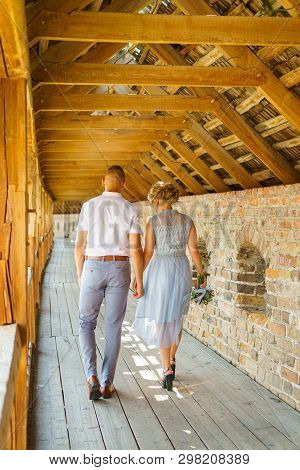 Happy Bride And Groom Walking On Gren Golf Course Outdoors, Copy Space. Wedding Couple In Love, Newl