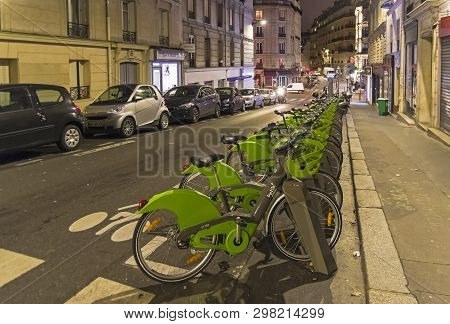 Paris, France - December 21, 2018: The Terminal Of The Velib Bike Rental System On An Evening Parisi