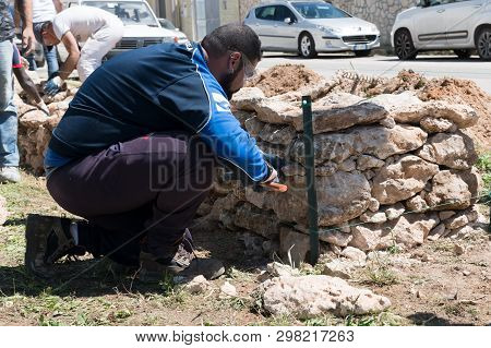 Maruggio, Italy - April 28, 2019 - Construction Of A Low Wall - Old Traditional Apulian Architectura
