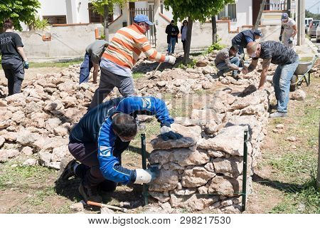 Maruggio, Italy - April 28, 2019 - Construction Of A Low Wall - Old Traditional Apulian Architectura