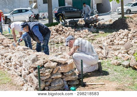 Maruggio, Italy - April 28, 2019 - Construction Of A Low Wall - Old Traditional Apulian Architectura