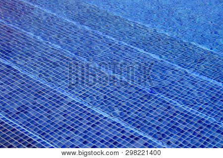 Blue Mosaic Tiled Swimming Pool Steps Seen Through Water - Image