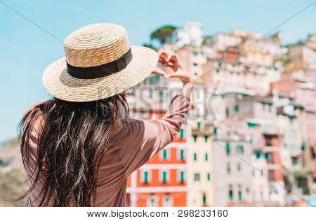 Happy Girl Making With Hands Heart Shape On The Old Coastal Village In Cinque Terre National Park. E
