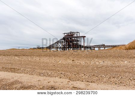Desert Industrial Landscape With Stationary Rusty Gravitational Separator Of Sand And Gravel On The 