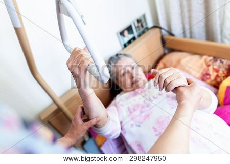An Old Woman Pulls Herself Up On A Gallows