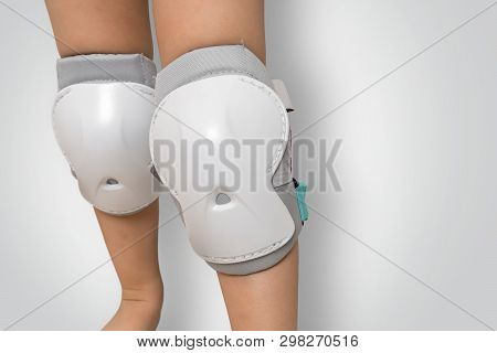 Pair Of Knee Pads Wearing On Legs Of Child