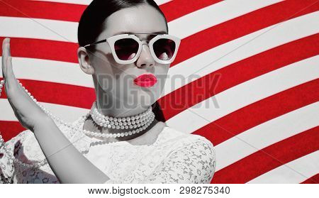 Portrait Of A Pretty Young Woman In White Lace Dess, White Pearl Necklace And  Sunglasses With Neon 