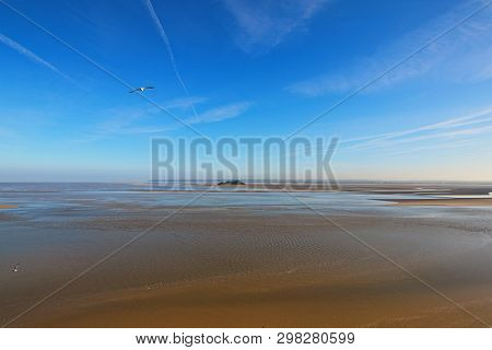 Low Tide In Front Of Mont Saint-michel Abbey. Amazing Landmark. Sunny Spring Morning View. Normandy,