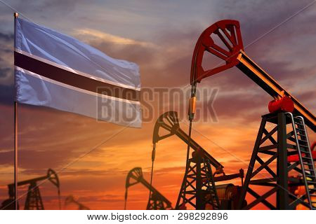 Botswana Oil Industry Concept, Industrial Illustration. Botswana Flag And Oil Wells And The Red And 
