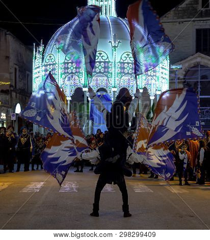 Modugno - Italy. March 9, 2018: Performance Of A Group Of Flag-wavers During The Evening Parade Of T