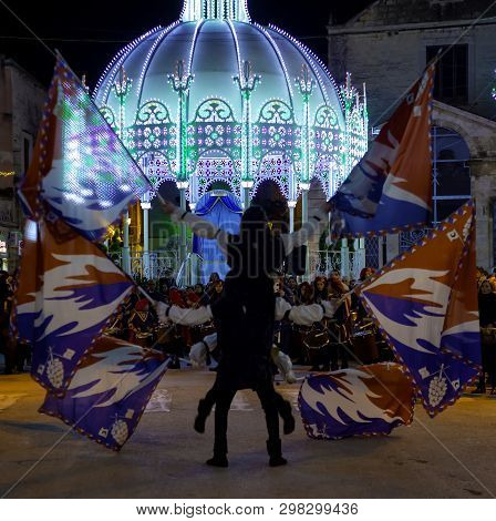 Modugno - Italy. March 9, 2018: Performance Of A Group Of Flag-wavers During The Evening Parade Of T