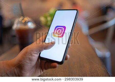 Chiang Mai, Thailand - Mar. 24,2019: Man Holding Xiaomi Mi Mix 3 With Instagram Application On The S