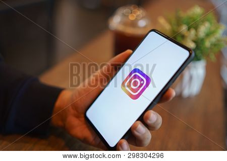 Chiang Mai, Thailand - Mar. 24,2019: Man Holding Xiaomi Mi Mix 3 With Instagram Application On The S