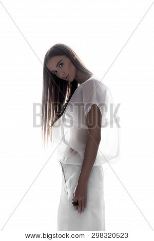Sensual Young Woman In Backlit On White