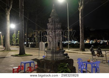 Siem Reap, Cambodia, December 13, 2018 A Small Buddhist Altar In The Park. A Table And Several Plast