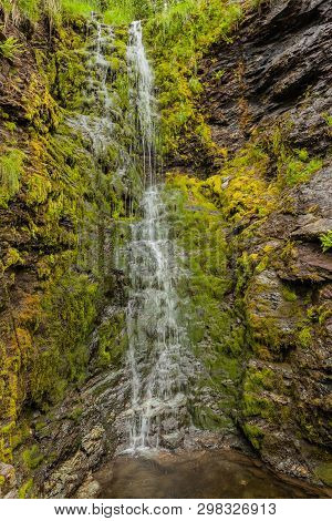 Little Waterfall In Green Summer Mountains, Norway.