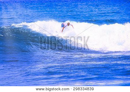 Hossegor, France - February Circa , 2019. An Unidentified Surfer Man Catching Riding On An Ocean Wav