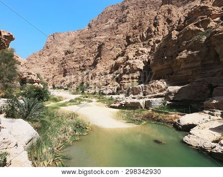 Wadi Shab,amazing Canyon With Stone Cliffs And Fresh Clean Water,sultanate Of Oman