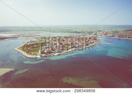 Aerial View Of City Of Nin. Summer Time In Dalmatia Region Of Croatia. Coastline And Turquoise Water