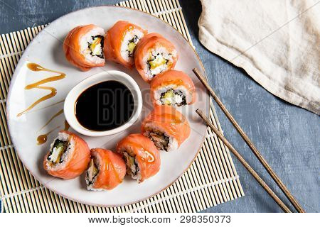 Salmon Sushi Set On The Plate With Soe Sauce. Top View, Copy Space For Text
