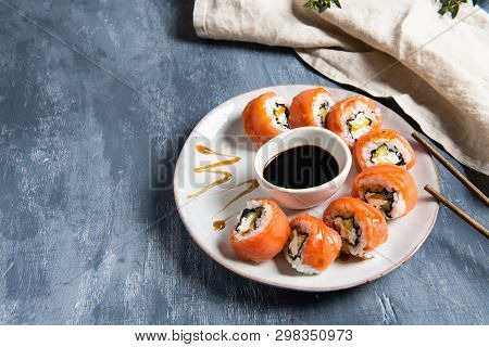 Philadelphia Roll Sushi With Salmon And Cucumber Served On The Plate With Soe Sauce. Japanese Food. 