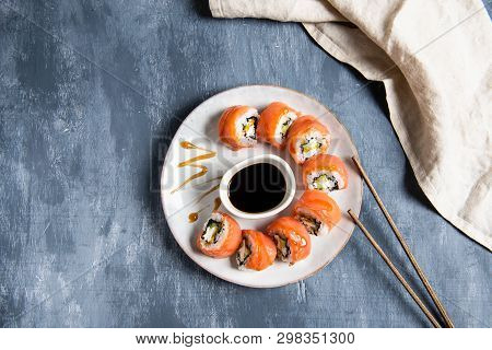 Salmon Sushi Set On The Plate With Soe Sauce. Top View, Copy Space For Text
