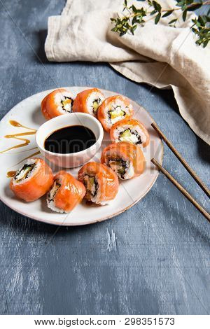Philadelphia Roll Sushi With Salmon And Cucumber Served On The Plate With Soe Sauce. Japanese Food. 