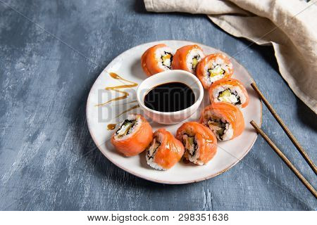 Philadelphia Roll Sushi With Salmon And Cucumber Served On The Plate With Soe Sauce. Japanese Food. 