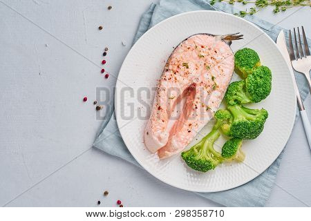 Steam Salmon, Broccoli, Paleo, Keto Or Fodmap Diet. White Plate On A Blue Table, Top View, Copy Spac
