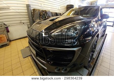 Moscow, Russia - April 29, 2019: Exclusive Black Porsche Cayenne On Suspension Check Stand In Servic