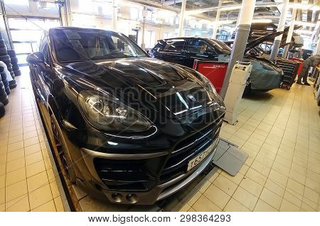 Moscow, Russia - April 29, 2019: Exclusive Black Porsche Cayenne On Suspension Check Stand In Servic