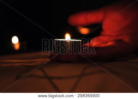 Candles Burning Over The Star Of David In Memory Of The Dead.