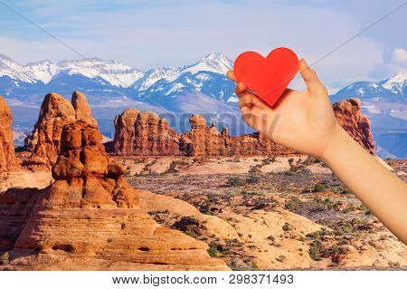 Hand Hold Red Heart Over Mt Waas And Arches Park