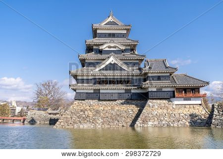 Matsumoto castle against blue sky in Matsumoto city in Nagano in Winter. Matsumoto Castle is an old historic castle in japan, its nickname is Crow Castle.