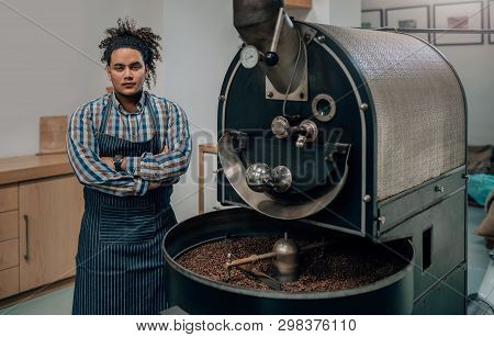 Entrepreneur In His Modern Well-kept Coffee Roastery And Distribution Factory