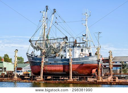 Buesum, Germany - July 31, 2018: The Fishing Cutter With The Name Jonas Su 16 Is Being Repaired In A