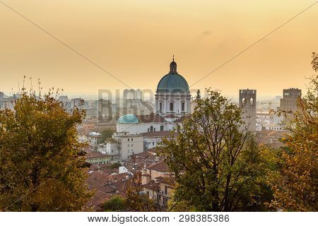 View Of Brescia City From Castle Of Brescia At Sunset. Italy